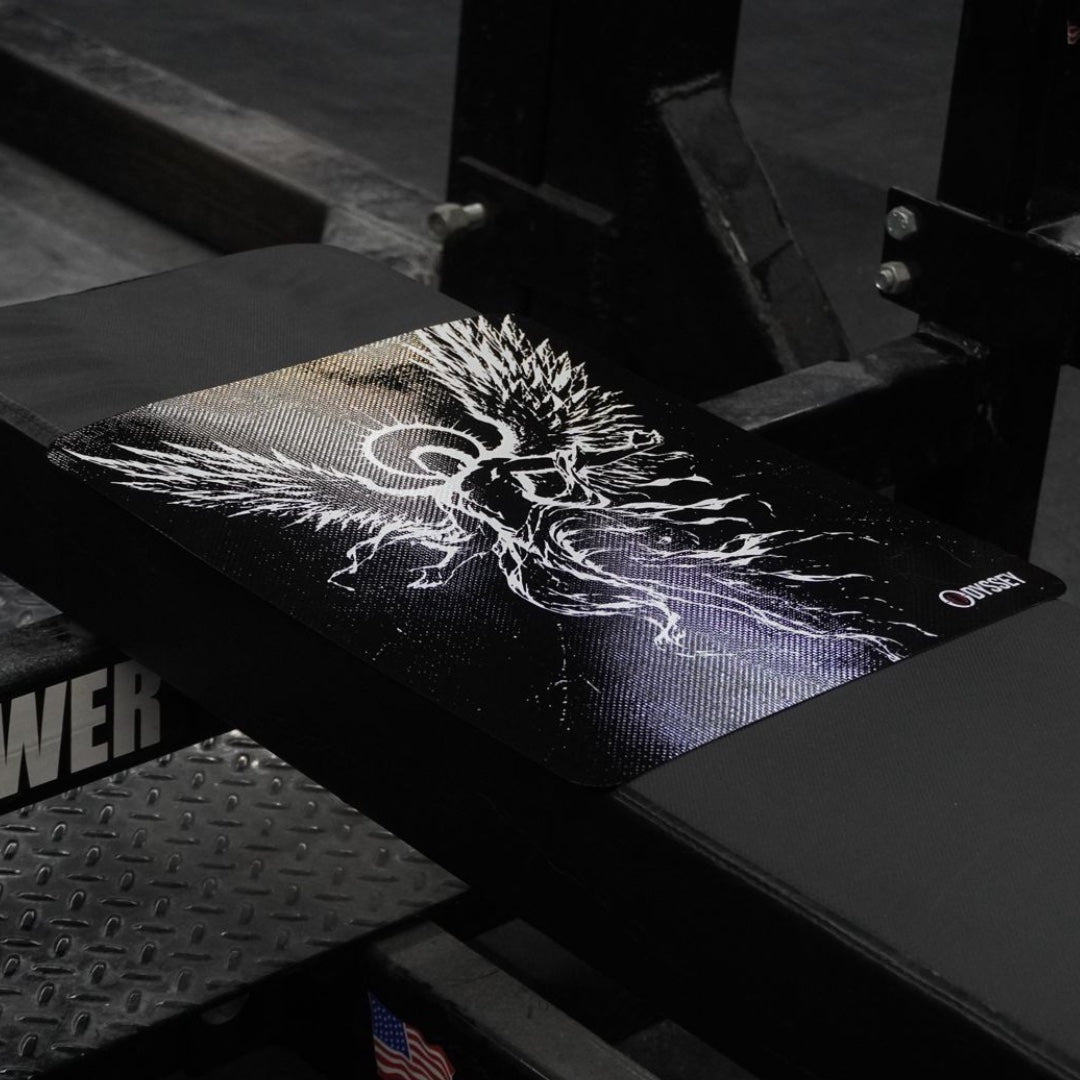 Close view of the Icarus artwork and Odyssey wordmark on the mat, lying on the bench pad